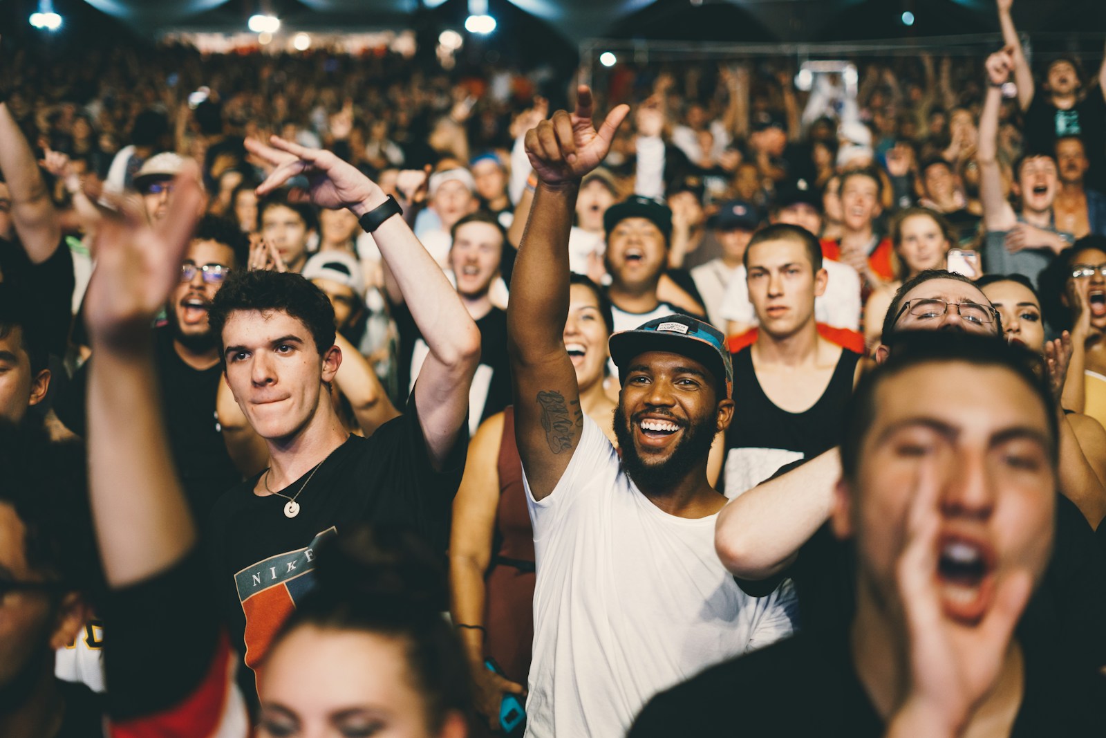 Concert audience under colorful lights